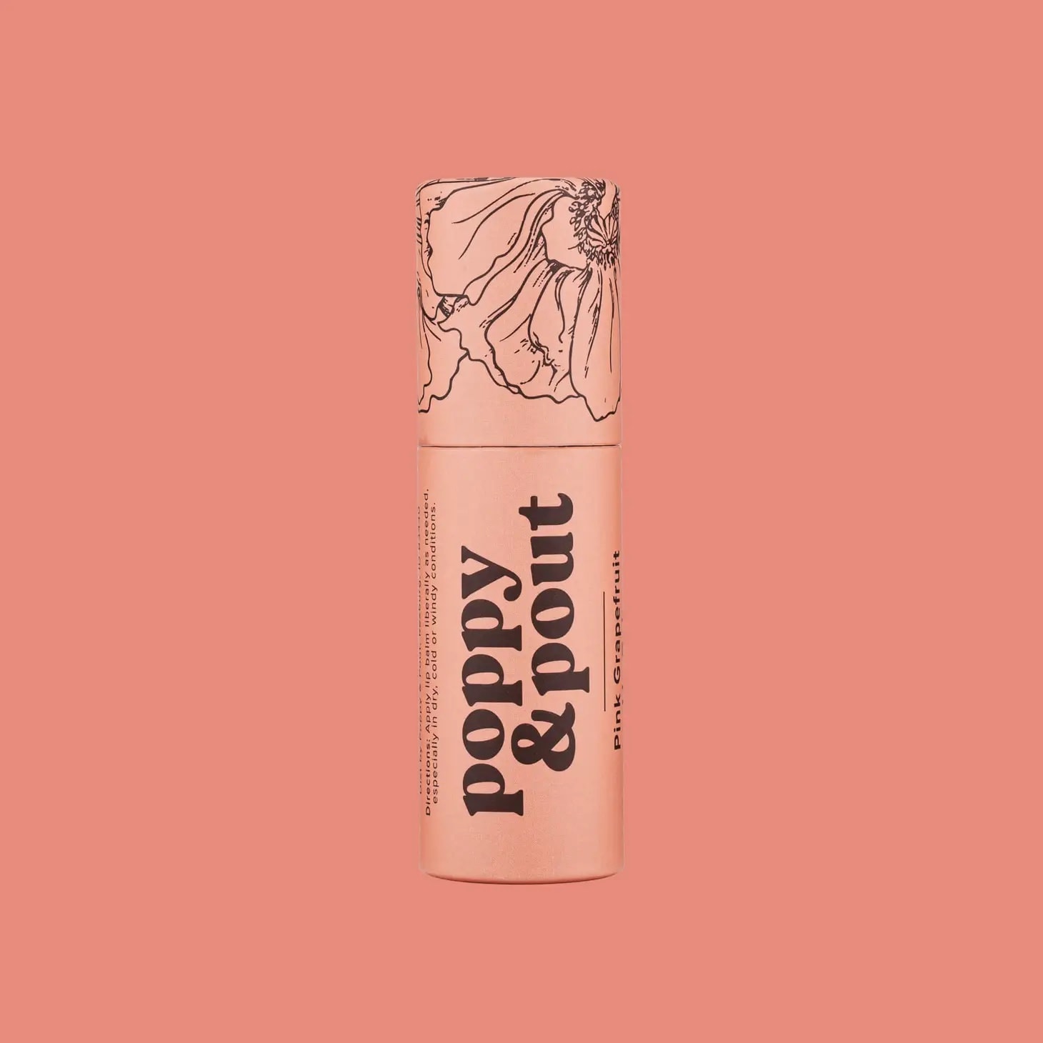 Pink lip balm tube with floral line art on a coral background