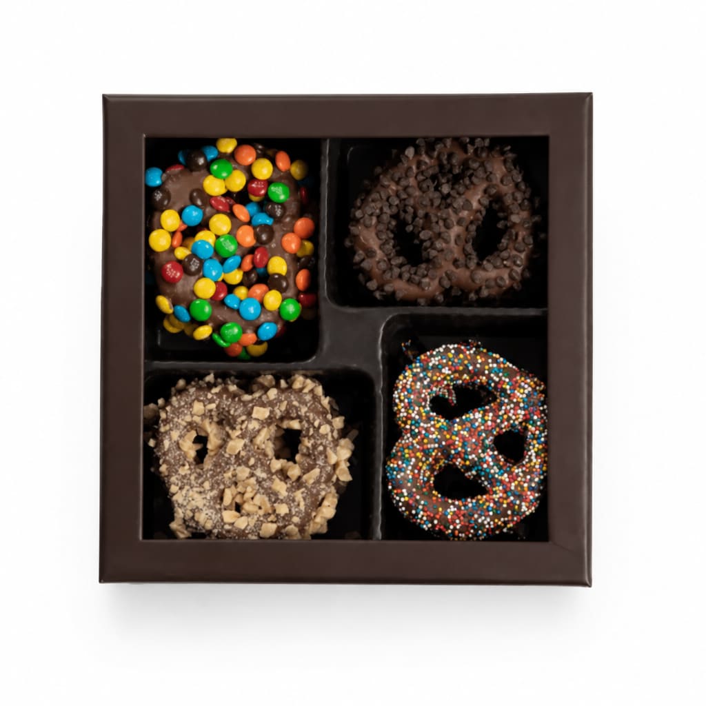 Box of chocolate-covered pretzels with assorted toppings