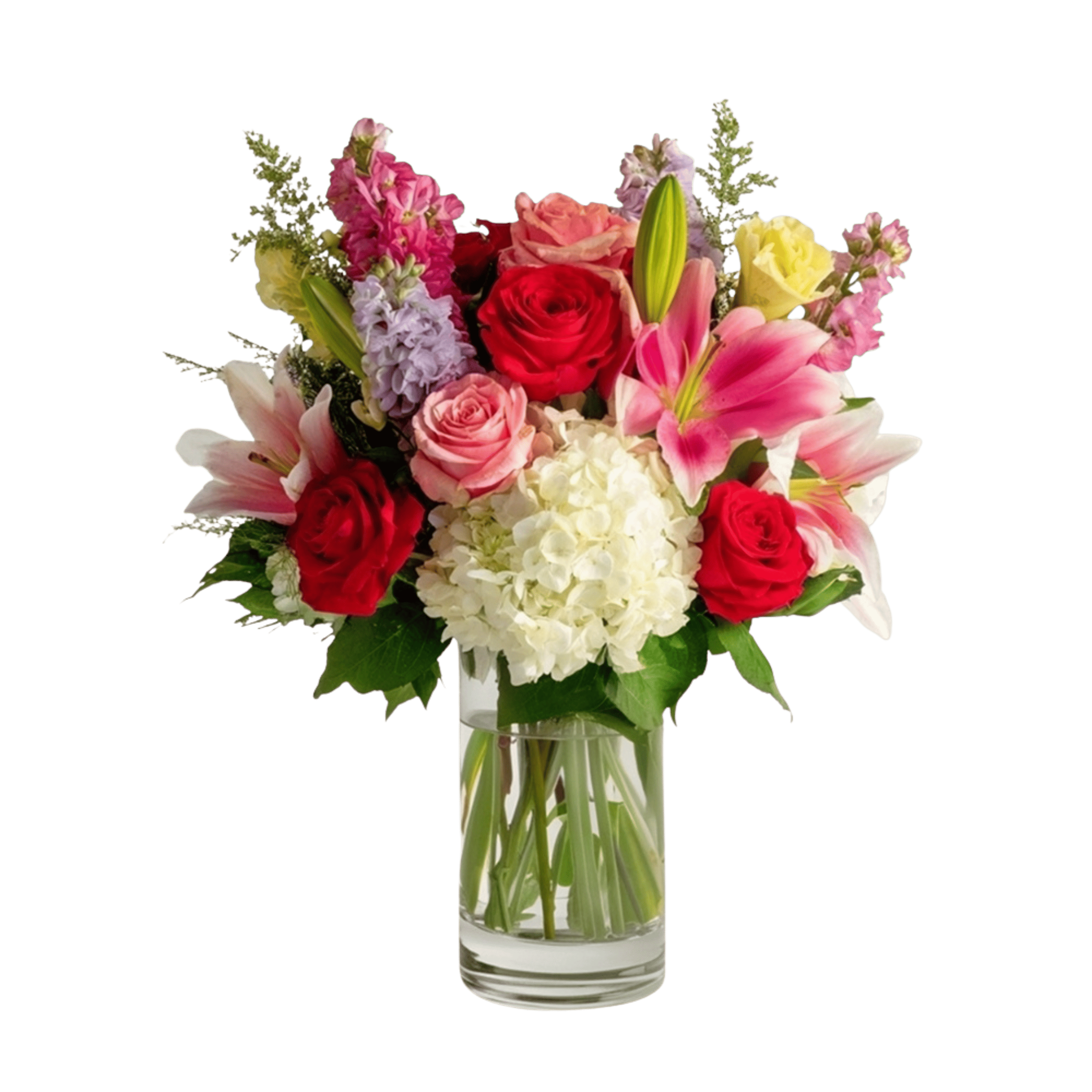 Mixed bouquet of roses, lilies, and hydrangea in a clear glass vase