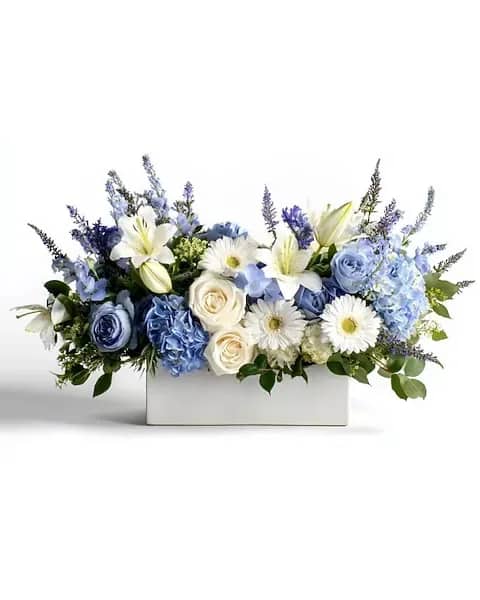 Blue and white floral arrangement in a white rectangular box