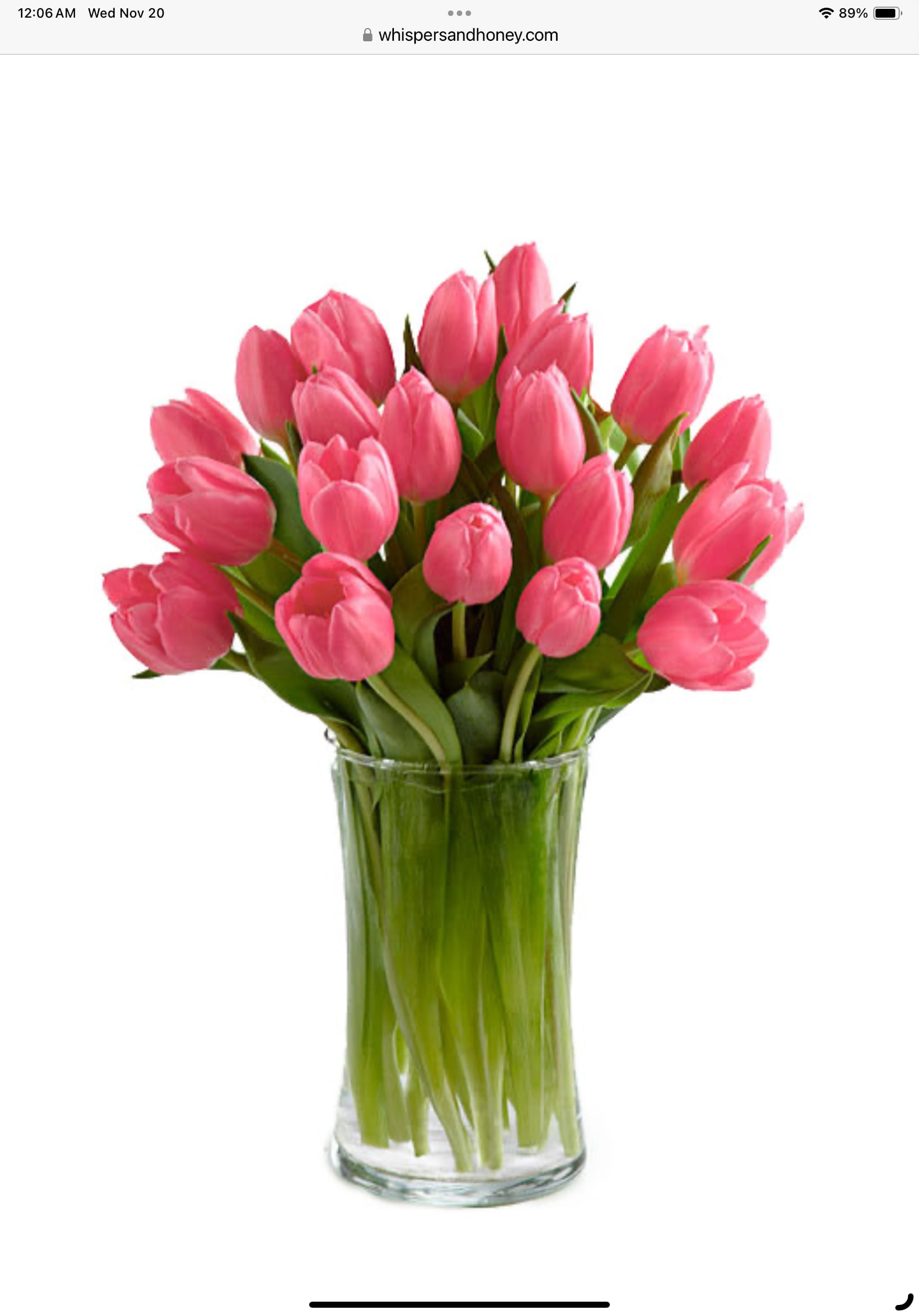Pink tulips arranged in a clear glass vase