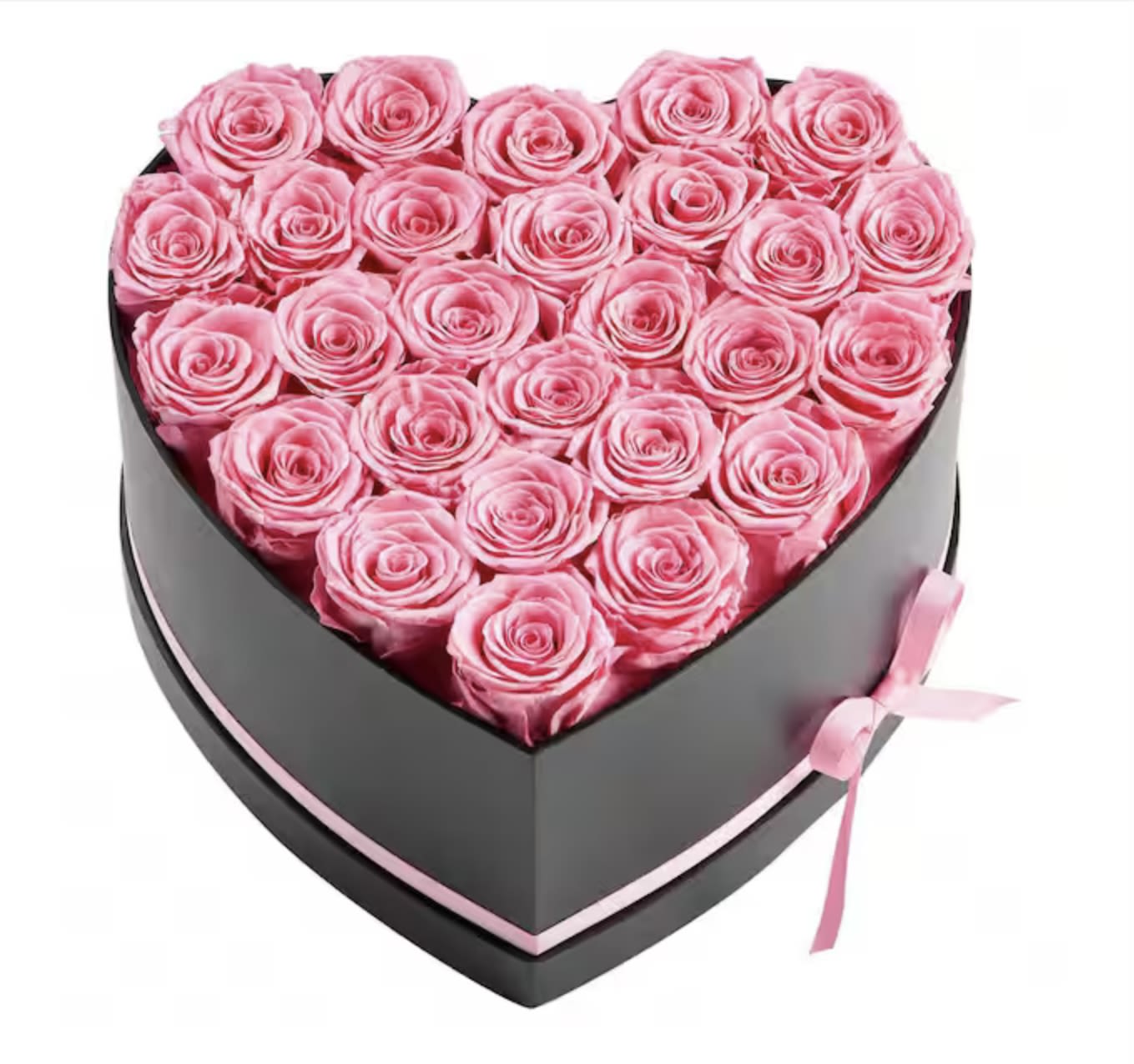 Heart-shaped box filled with pink roses and tied with a pink ribbon
