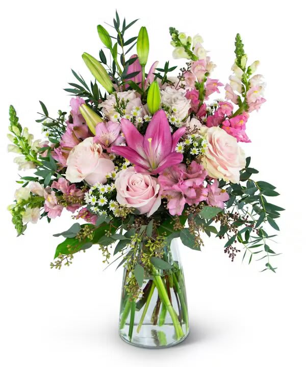 Pink and white mixed bouquet in a clear glass vase