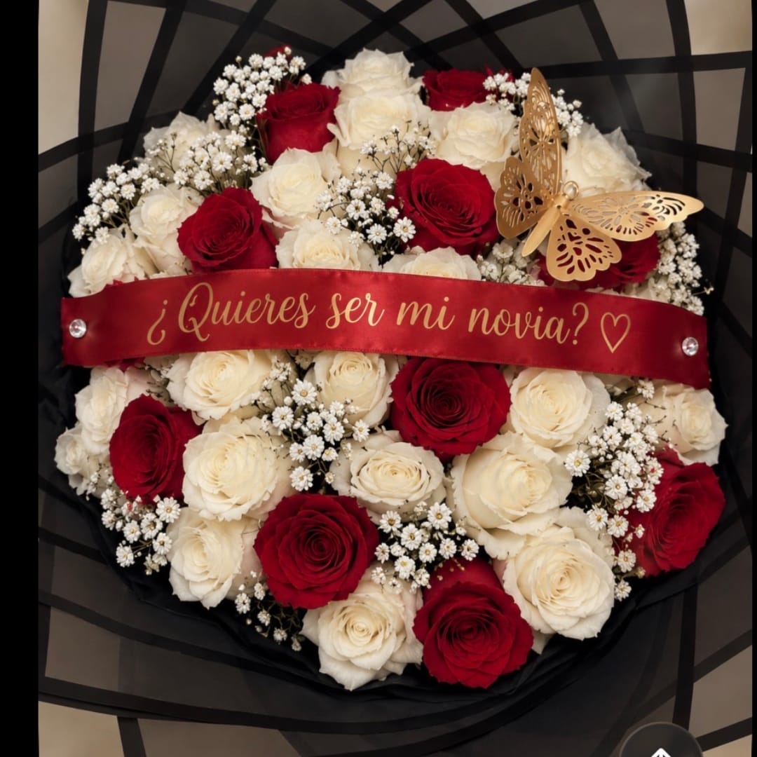Red and white rose bouquet with a ribbon and butterfly decoration