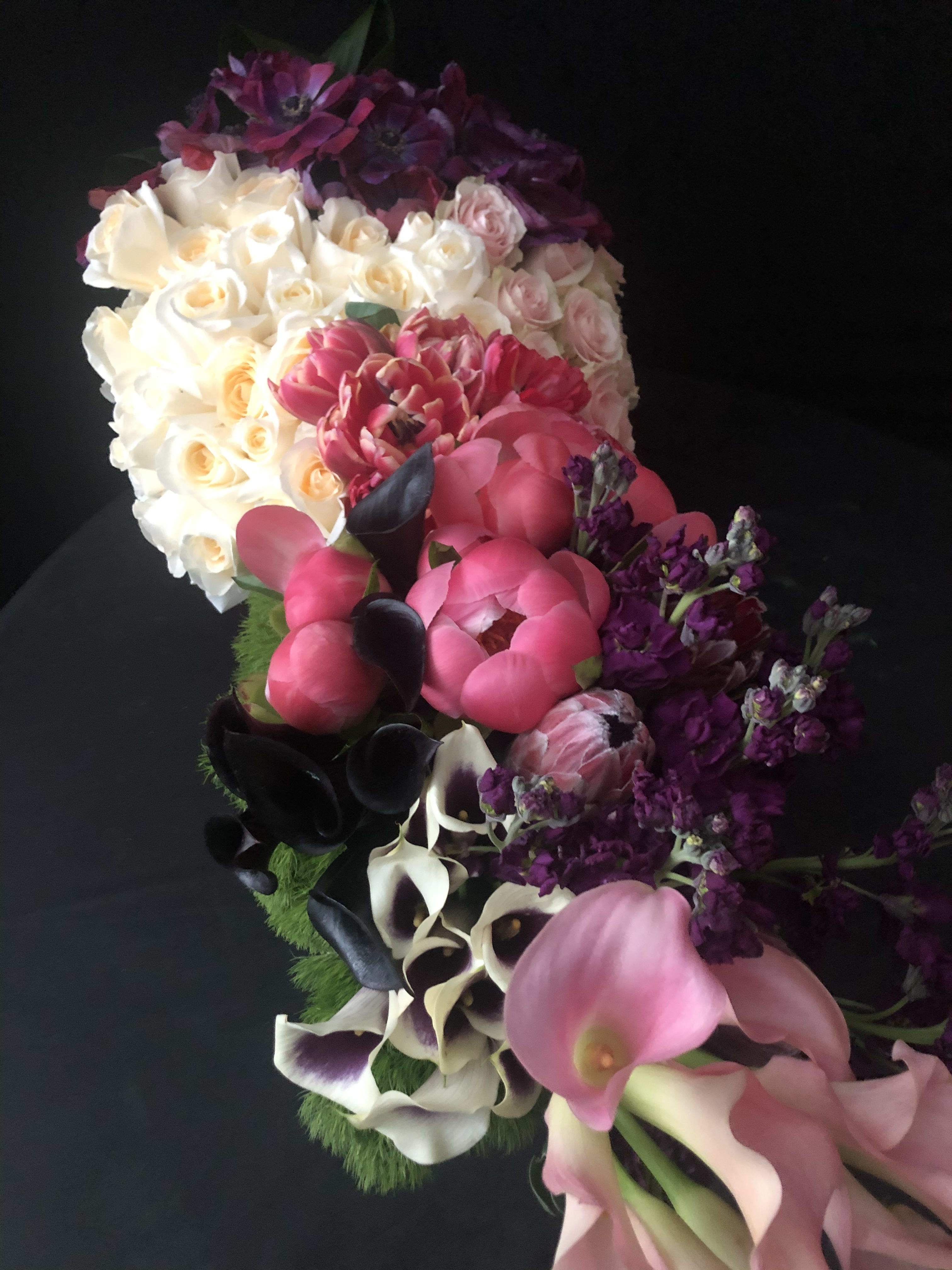 Grand Garden of LOVE.  - This 21 inch long wood box is filled with over 100 stems...125 to be exact! She loves flowers, flowers and more flowers then this is a design for her.  This design includes roses, peonies, stock, anemones, dianthus...to name a few. 