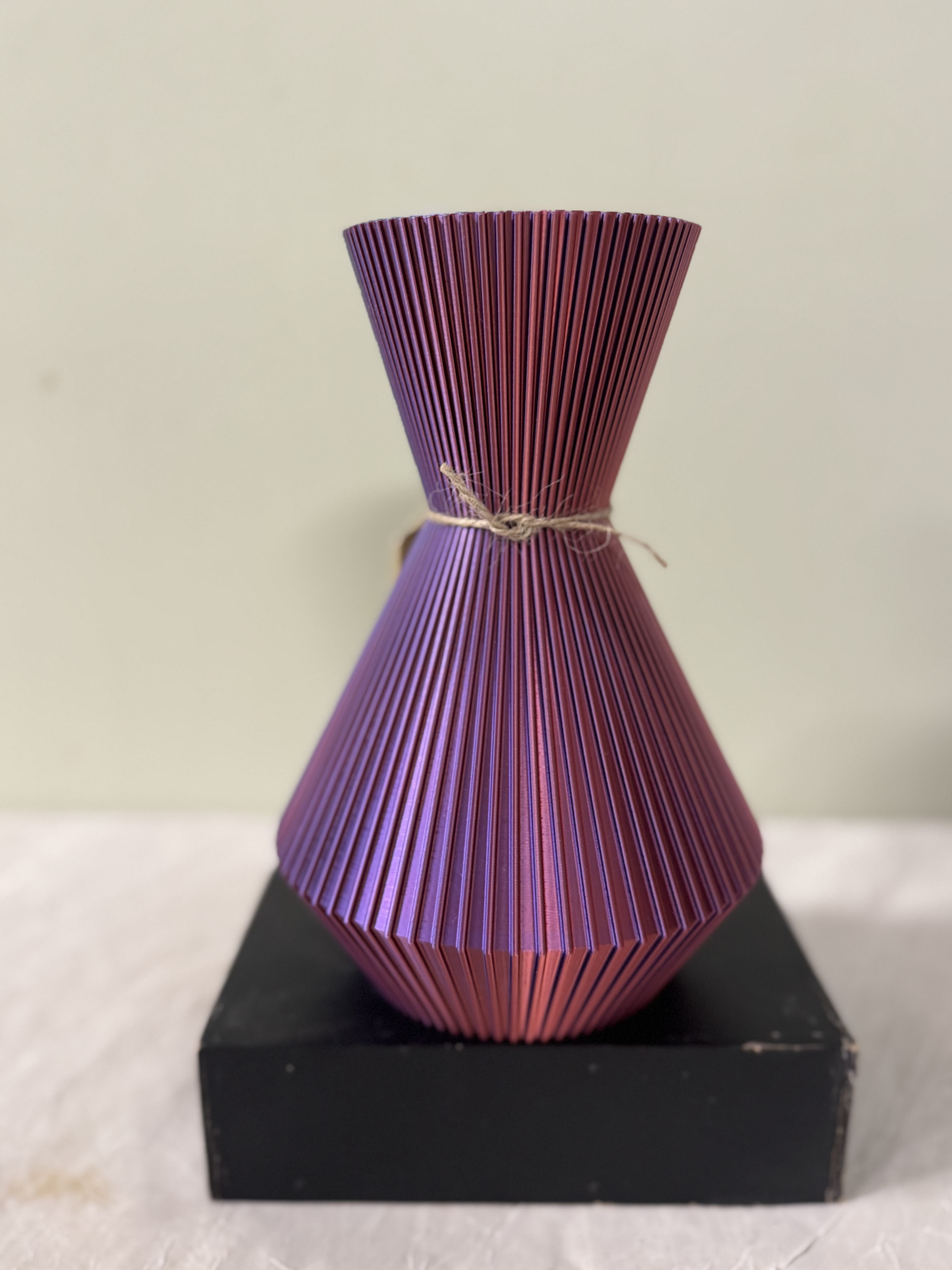 3D Color changing Vase - This product is manufactured using 3D printing, an energy-efficient process that enables on demand production while significantly reducing waste compared to traditional manufacturing methods.  Made with a biodegradable polymer derived primarily from renewable resources such as corn, sugarcane, and beets.  These raw materials are fermented to produce lactic acid, which is then polymerized to form PLA.    -Vases are ideal for both fresh and dried flowers. -Not intended for food use.  -Not recommended for outdoor use in direct sunlight.   -Handle with care -100% waterproof.  ***This item will be shipped***