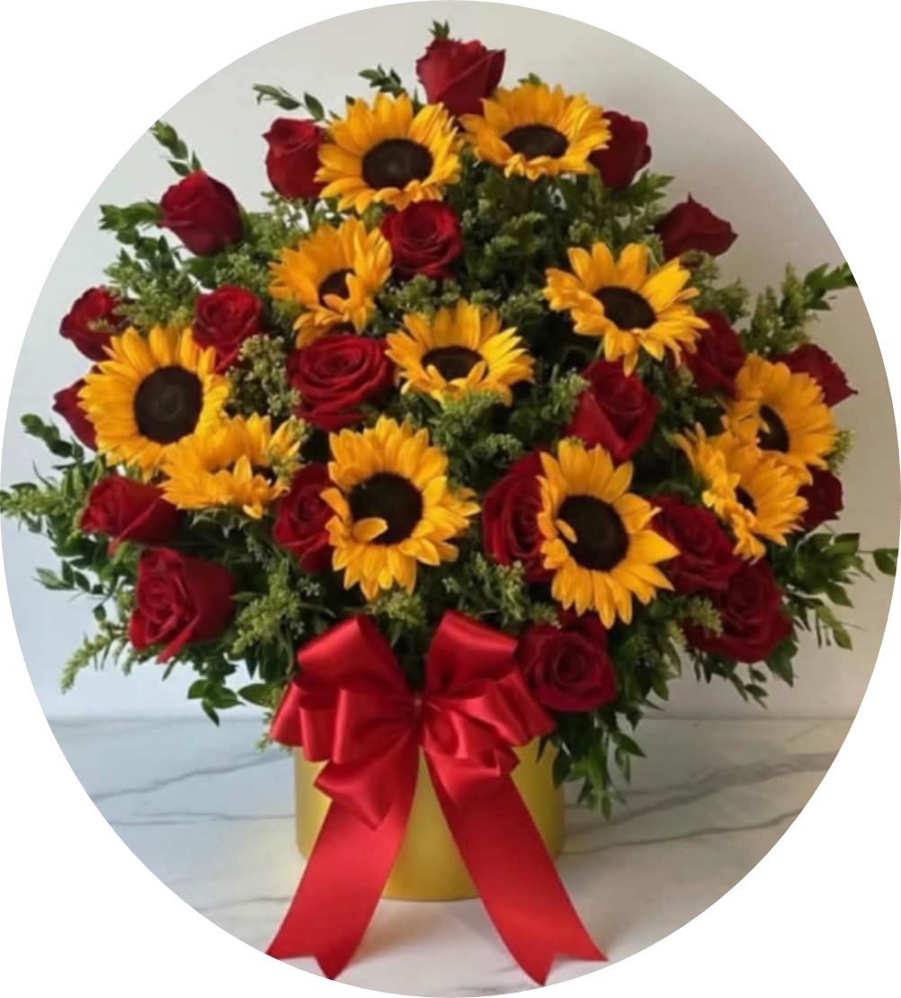 Sunflowers and red roses in a yellow box with a red ribbon