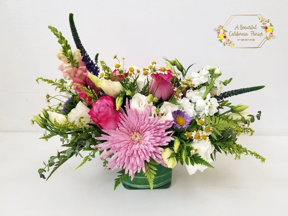 Long Beach Garden Arrangement - Fresh, wild and fun - Long Beach Garden arrangement, our floral artisan selects the freshest blooms of the day in pastel and complimentary colors to create this beautiful arrangement. It comes arranged in  modern cube vase color may vary, accents of lush greens and leaves. Order Long Beach Garden today from A Beautiful California Florist, Long Beach CA offering same day delivery.