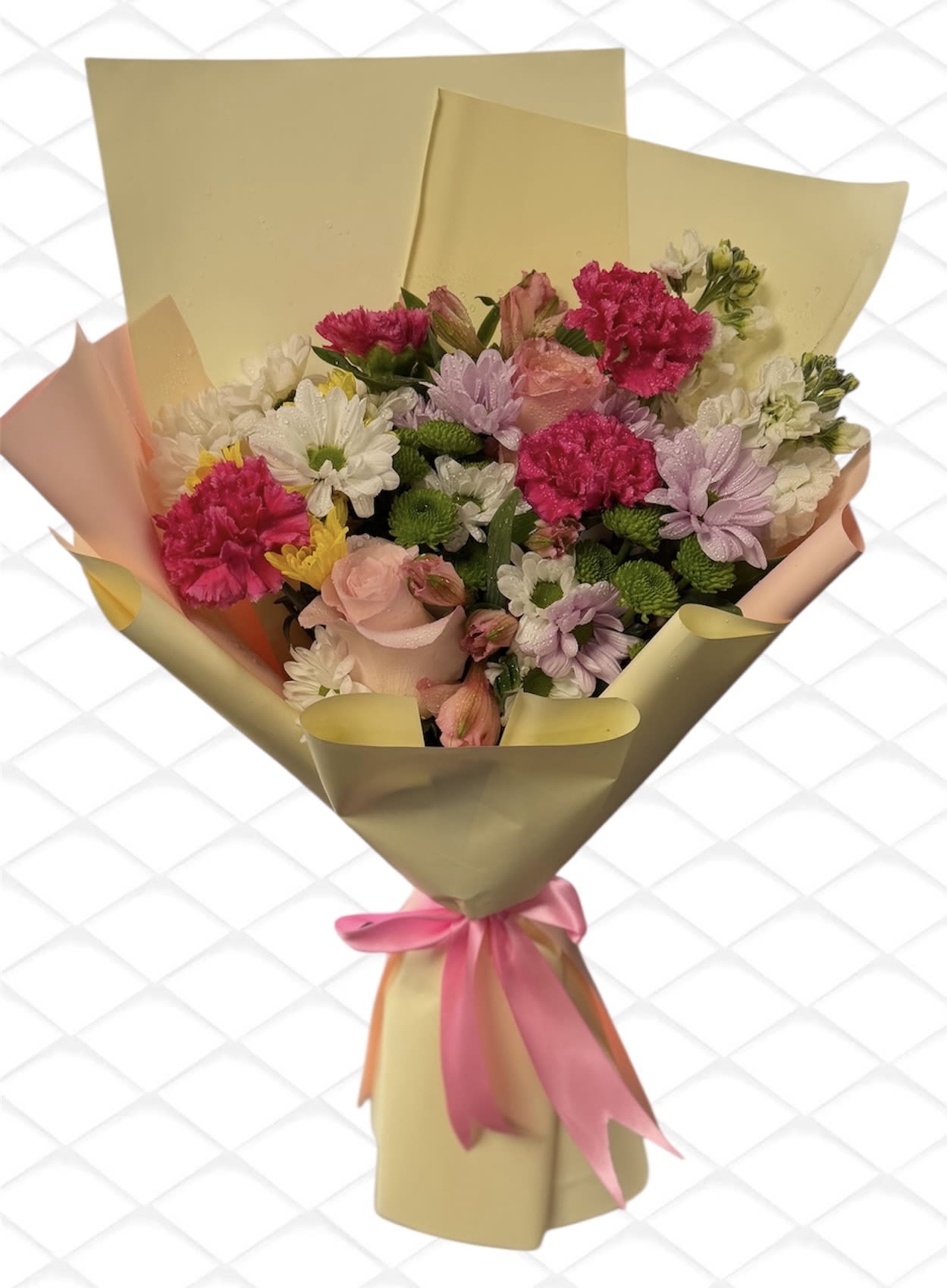 Bouquet of pink, white, and lavender flowers wrapped in gold paper with a pink ribbon