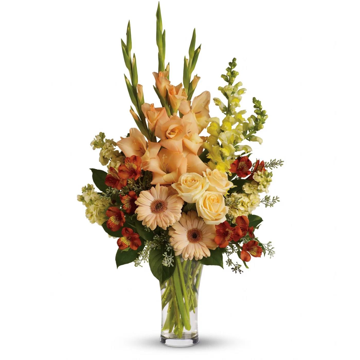 Summer's Light Bouquet by Teleflora - Express your condolences in tasteful shades of color with peach, orange and yellow flowers in a stylish trumpet vase. For the service or the home, it is an elegant choice. 