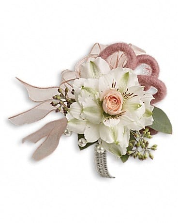 Small white and blush floral corsage with ribbon and pearl accents