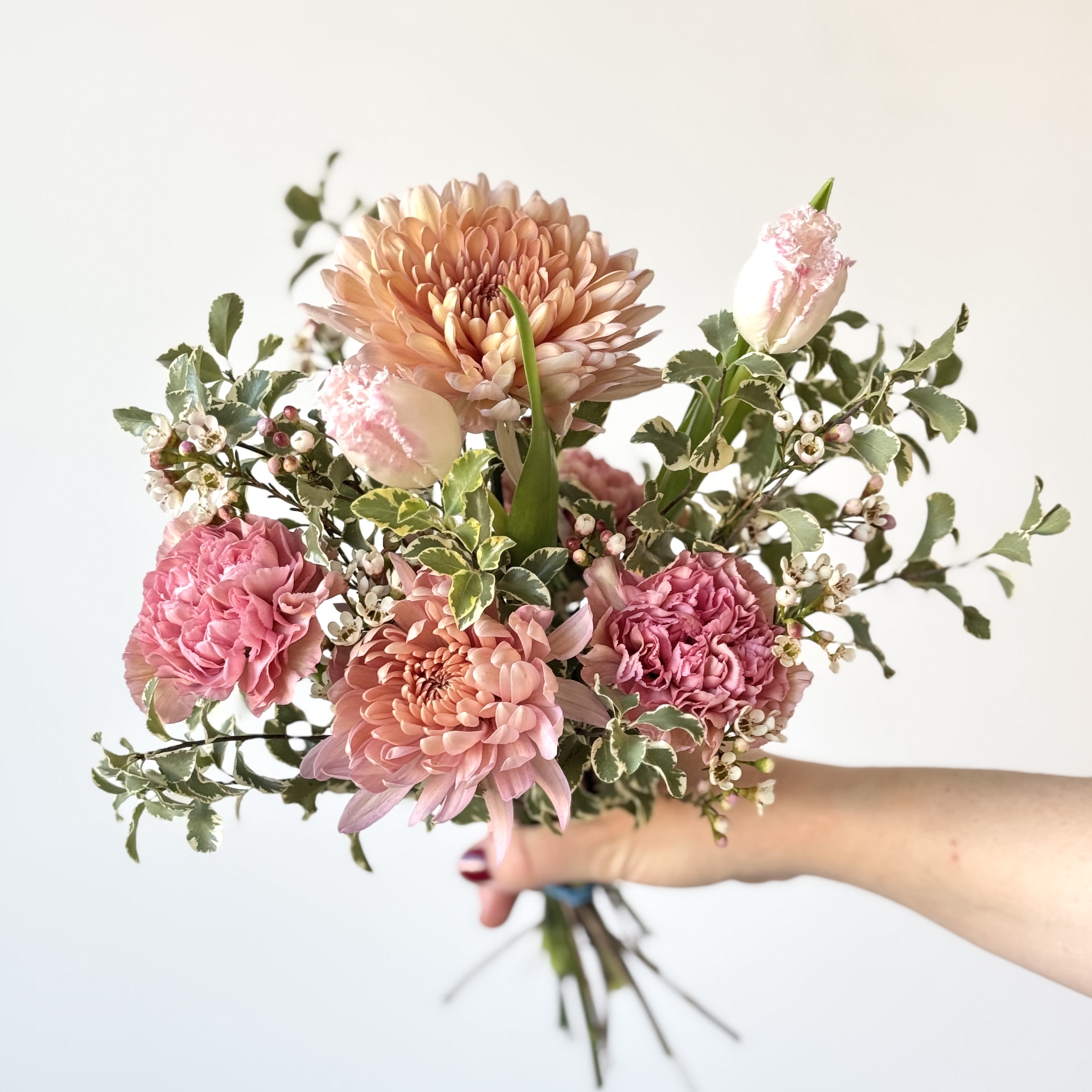 Designer's Choice Bouquet -Mini - Designer's Choice Mini Bouquet, Grab n Go. In Studio only. These mini bouquets are thoughtfully arranged with fresh, seasonal blooms chosen by our designers. Perfect for a quick gift or a little something just because. Pricing includes a wet wrap, paper wrap, and ribbon.