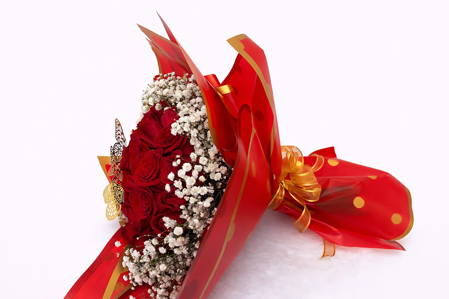 Bouquet of red roses with white baby's breath in red wrapping
