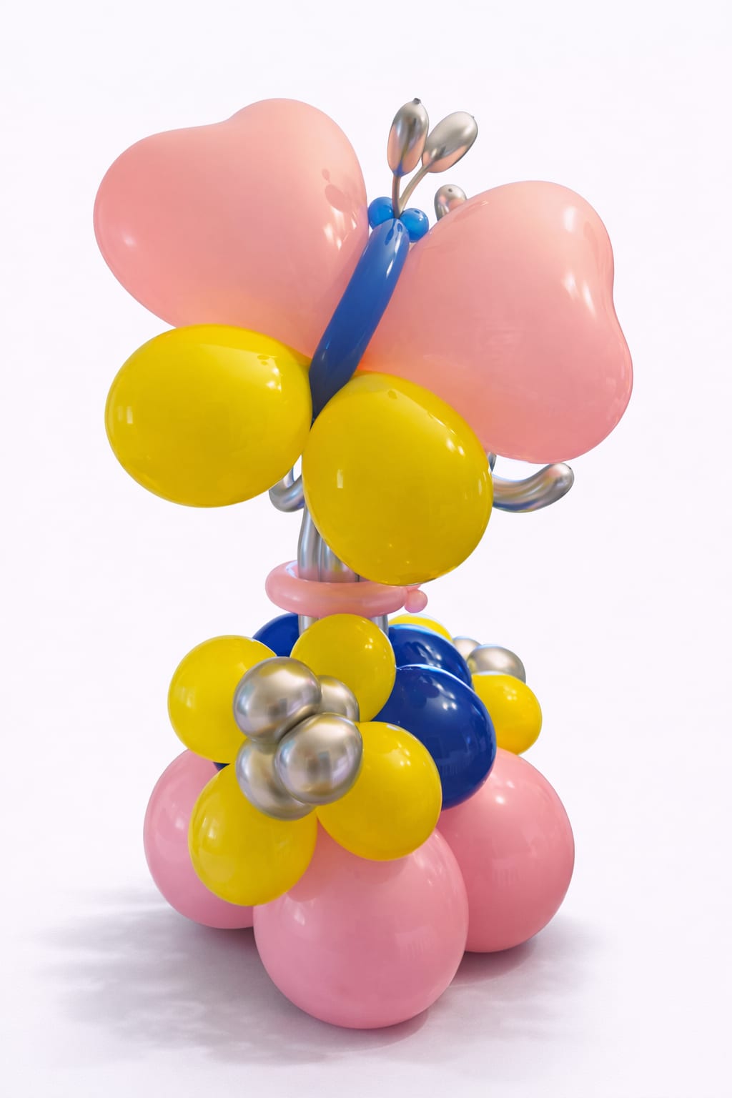 Balloon sculpture shaped like a butterfly with pink, yellow, blue, and silver balloons
