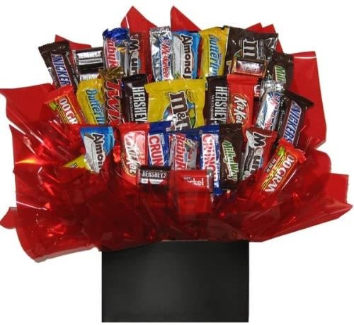 Assorted candy bars arranged in red wrapping with a black box base
