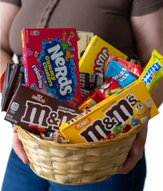 Candy Basket - Looking to send the perfect gift to someone special with a sweet tooth? Look no further than Everyone's Favorite Candy Basket! Hand arranged and hand delivered by a local florist, this candy basket is generously packed with some of America's favorite and famous sweet treats. This gift is perfect for all ages and for almost any occasion! Send today. Please note: contents may vary.  Includes: • Chocolate &amp; Candy Variety • Keepsake Gift Basket • Personalized Gift Message