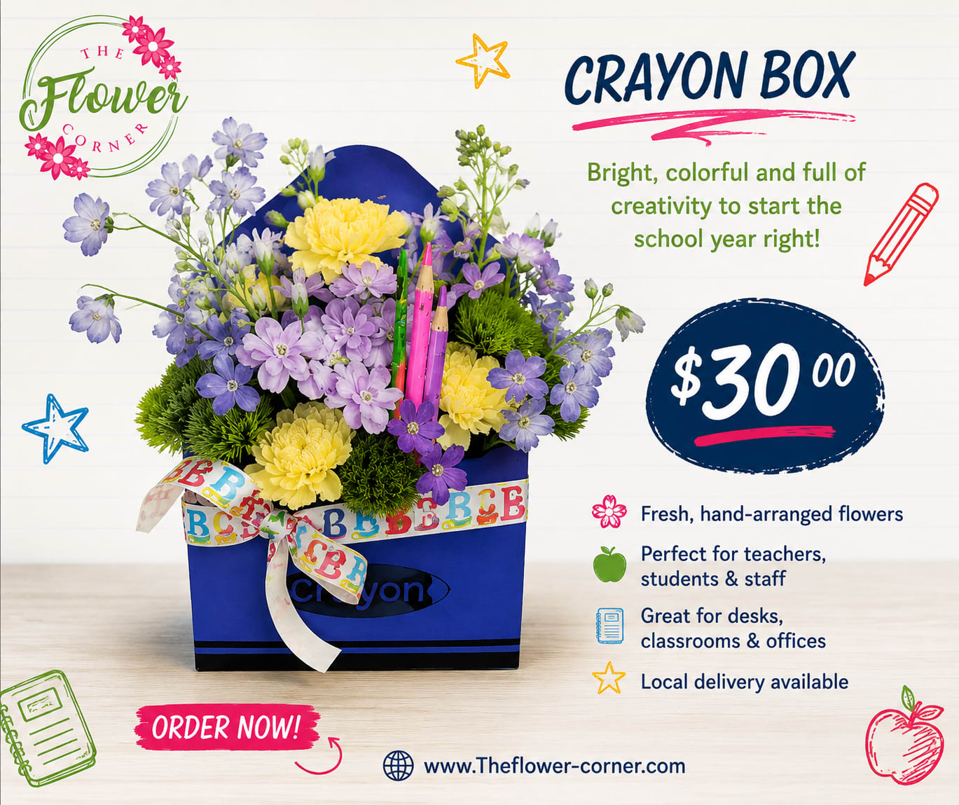 Blue crayon box arrangement with purple and yellow flowers and a ribbon