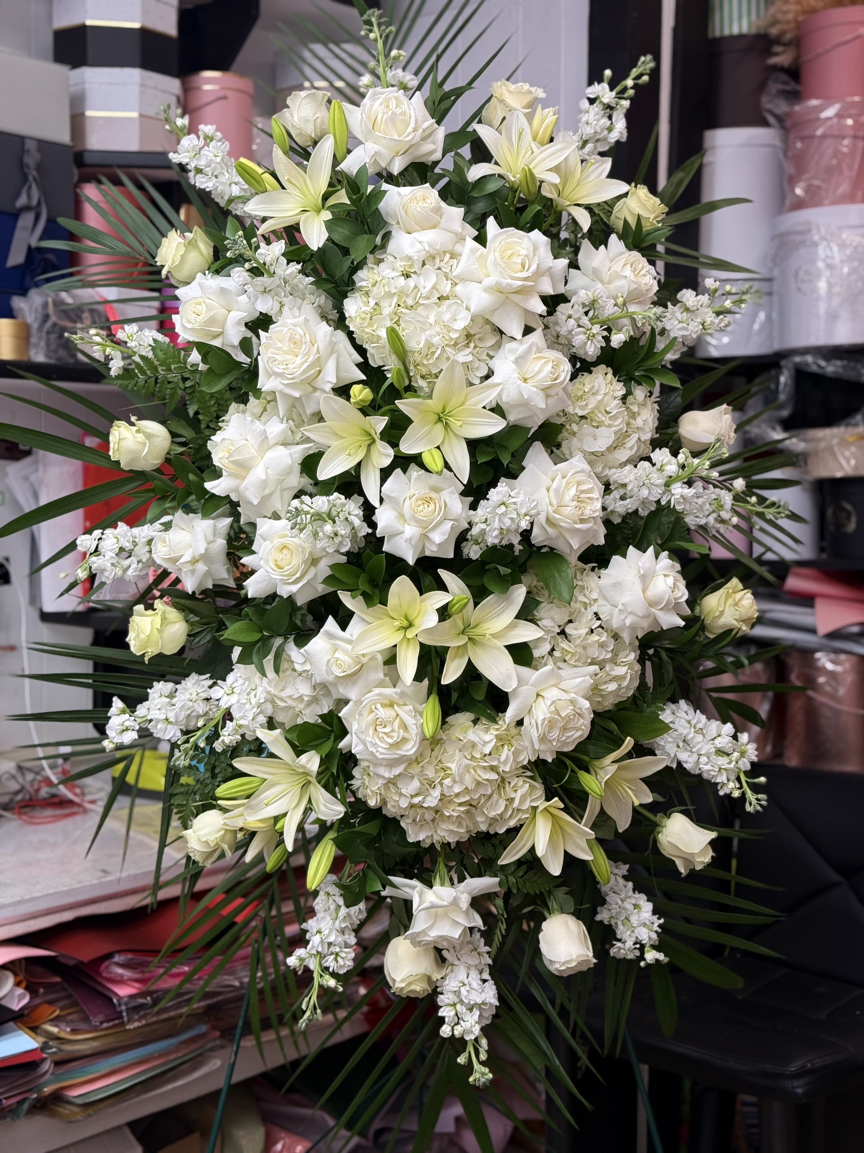 Large white floral spray with roses and lilies