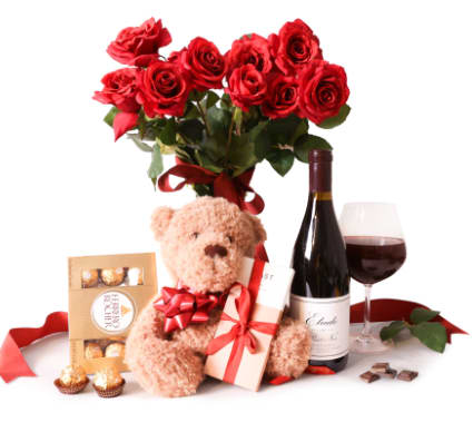 Red rose bouquet with a teddy bear, wine, chocolates, and a gift box