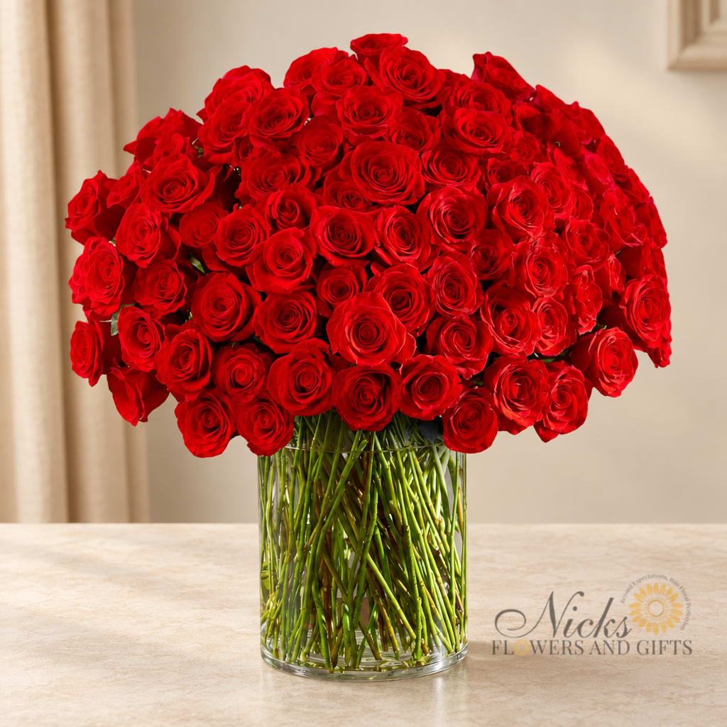 Large bouquet of red roses in a clear glass vase