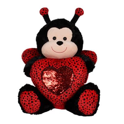 Plush ladybug holding a red heart