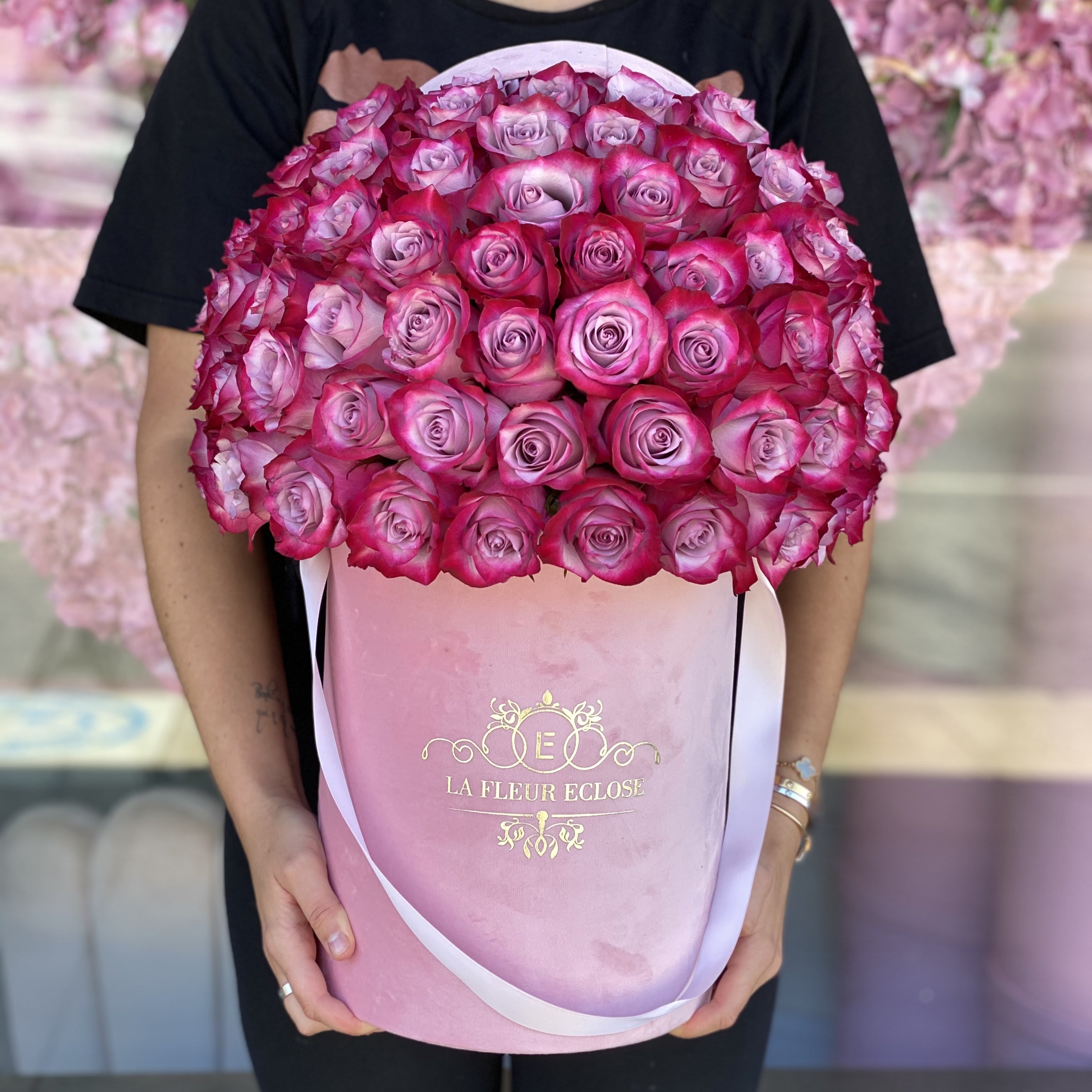 Deep Purple Roses VD - FRESH CUT ROSES Standard includes 50 roses in our signature pink velvet box. Deluxe includes 75 roses in our signature pink velvet box. 