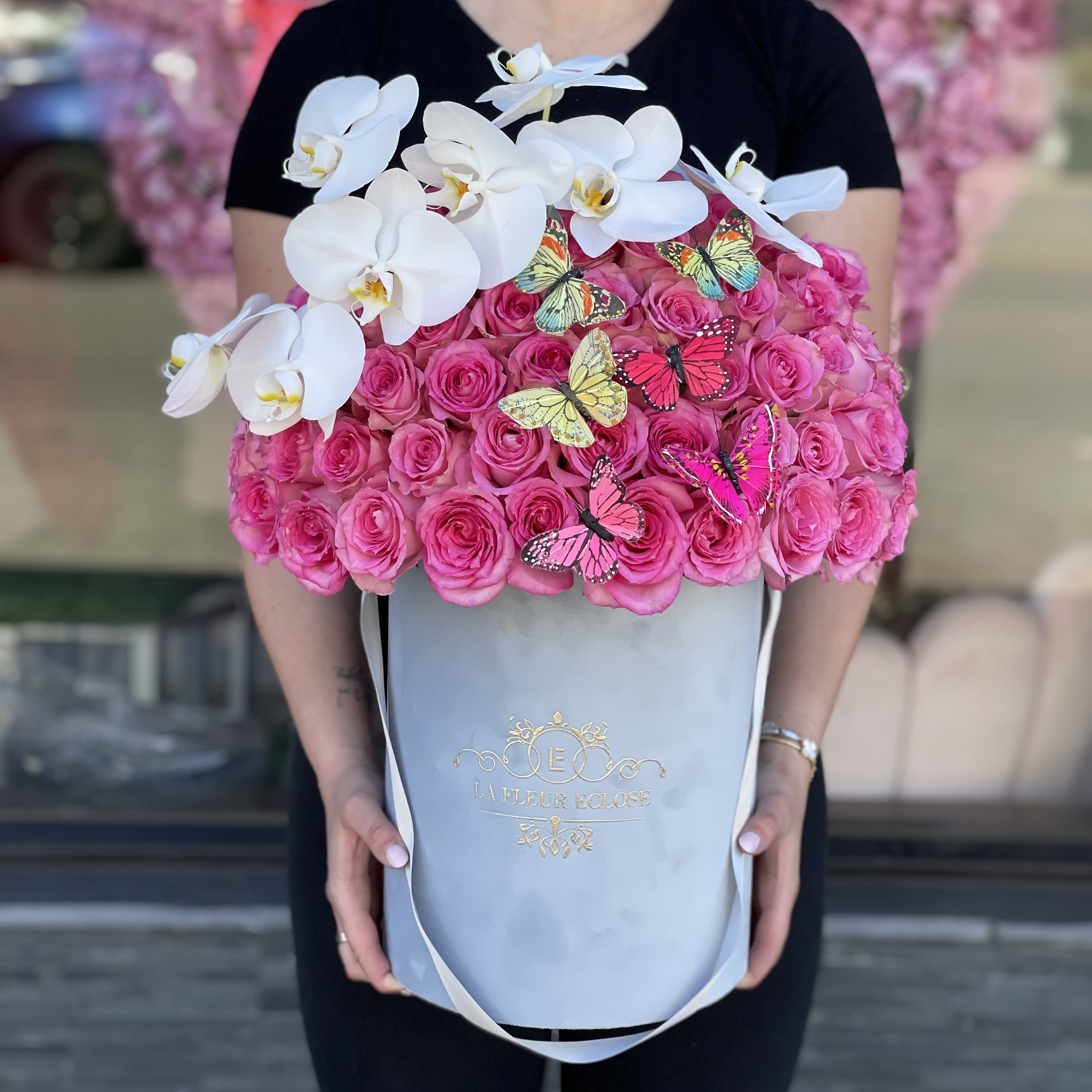 Beauty For You V - FRESH CUT ROSES Standard 50 red roses in our signature grey box comes with butterflies and orchid Deluxe 75 red roses in our signature grey box comes with butterflies and orchid.