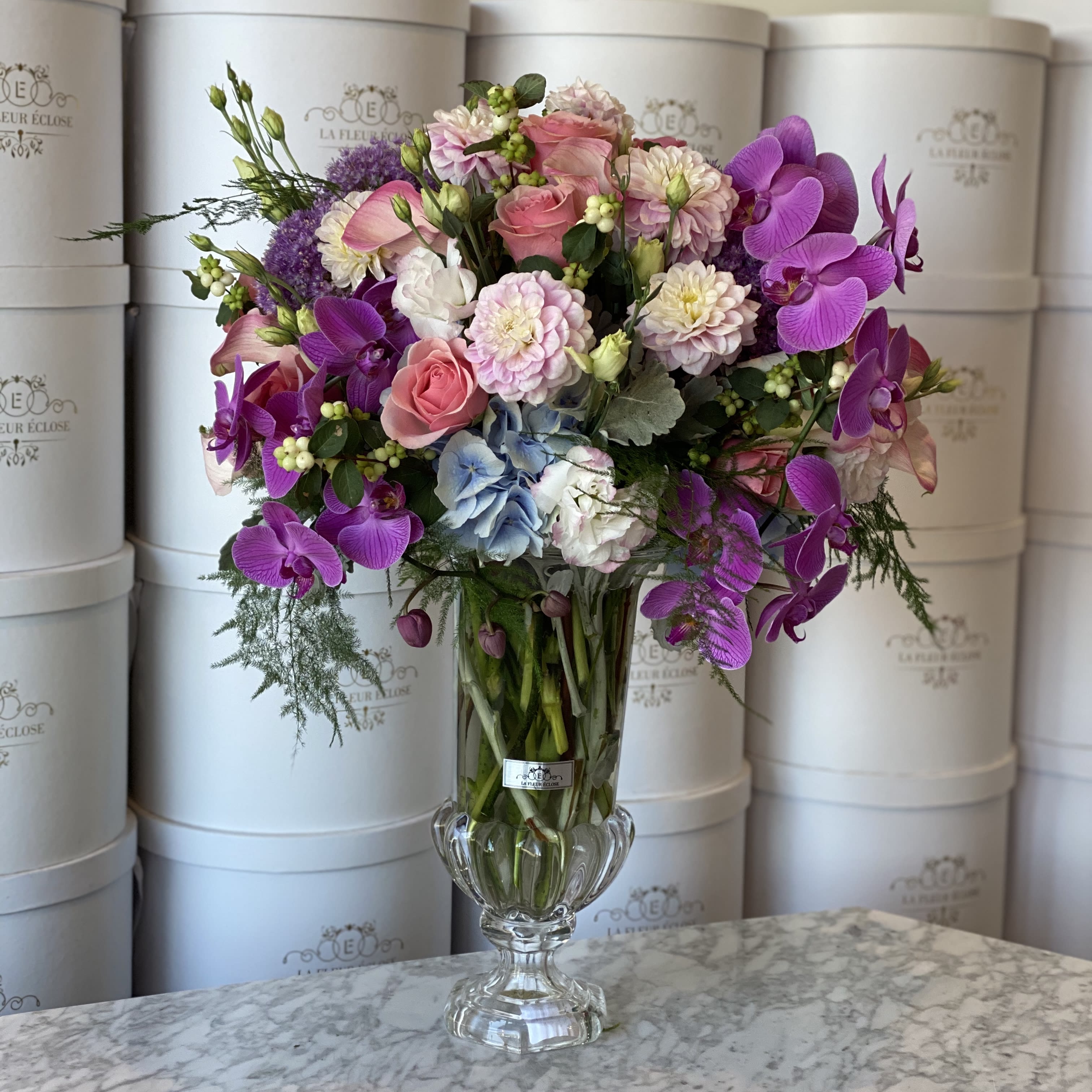 Vase of purple V  - Mix of flowers in a vase. Standard- as you see on the picture  Deluxe -  it is going to be bigger Premium -huge arrangement with premium flowers 