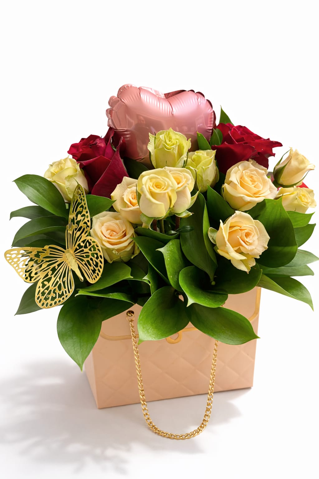 Bouquet of red and cream roses in a gift box with a pink heart balloon