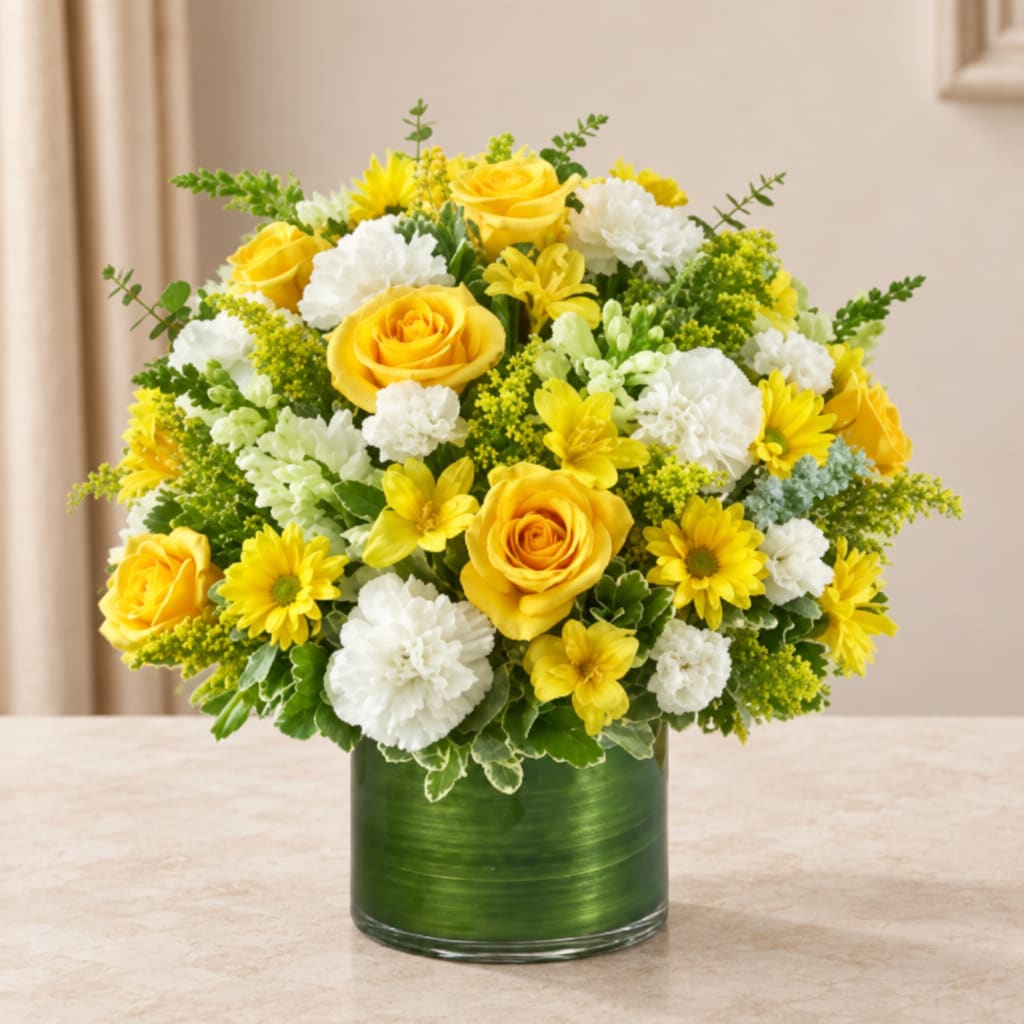Yellow roses and white flowers arranged in a green vase