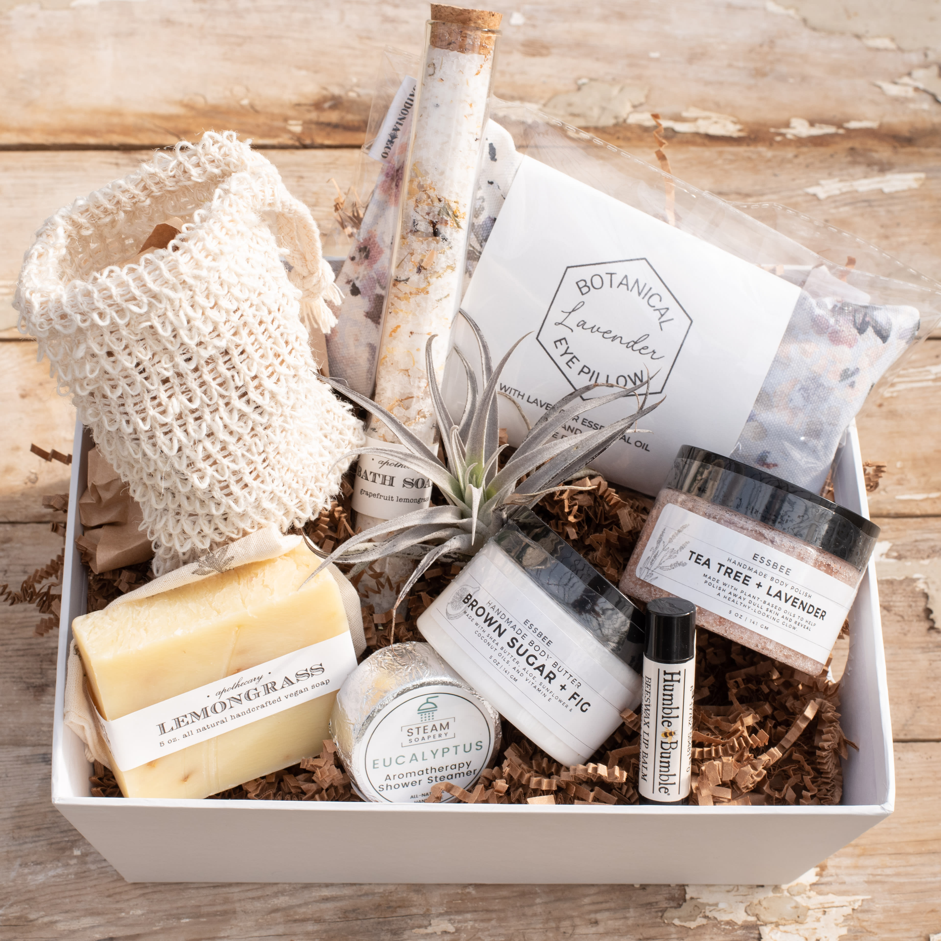 Gift box with soaps, bath items, and a small air plant
