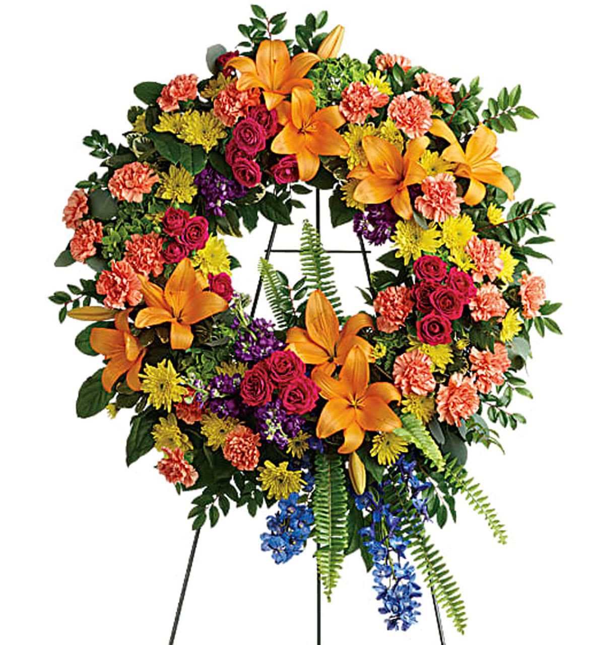 Large multicolored floral wreath on a stand