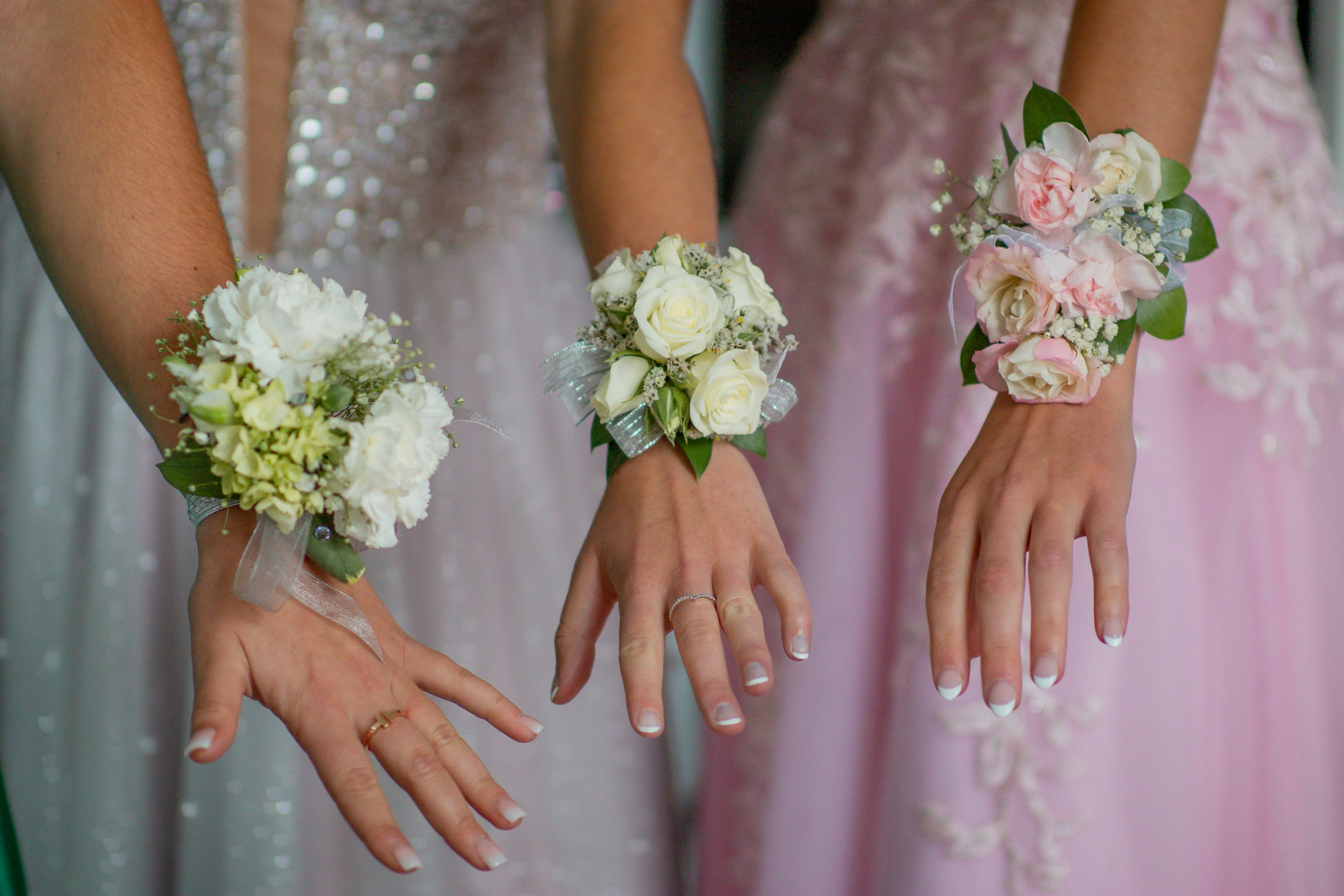 Wrist corsage, your choice of colors - Ready to dance the night away? Do it in style with a stunning wrist corsage. Spray roses are paired with greens, fillers, and the perfect ribbon to match your perfect dress! Please tell me what color you need in the special instructions or call 719-557-2778 and we can talk about your colors. 