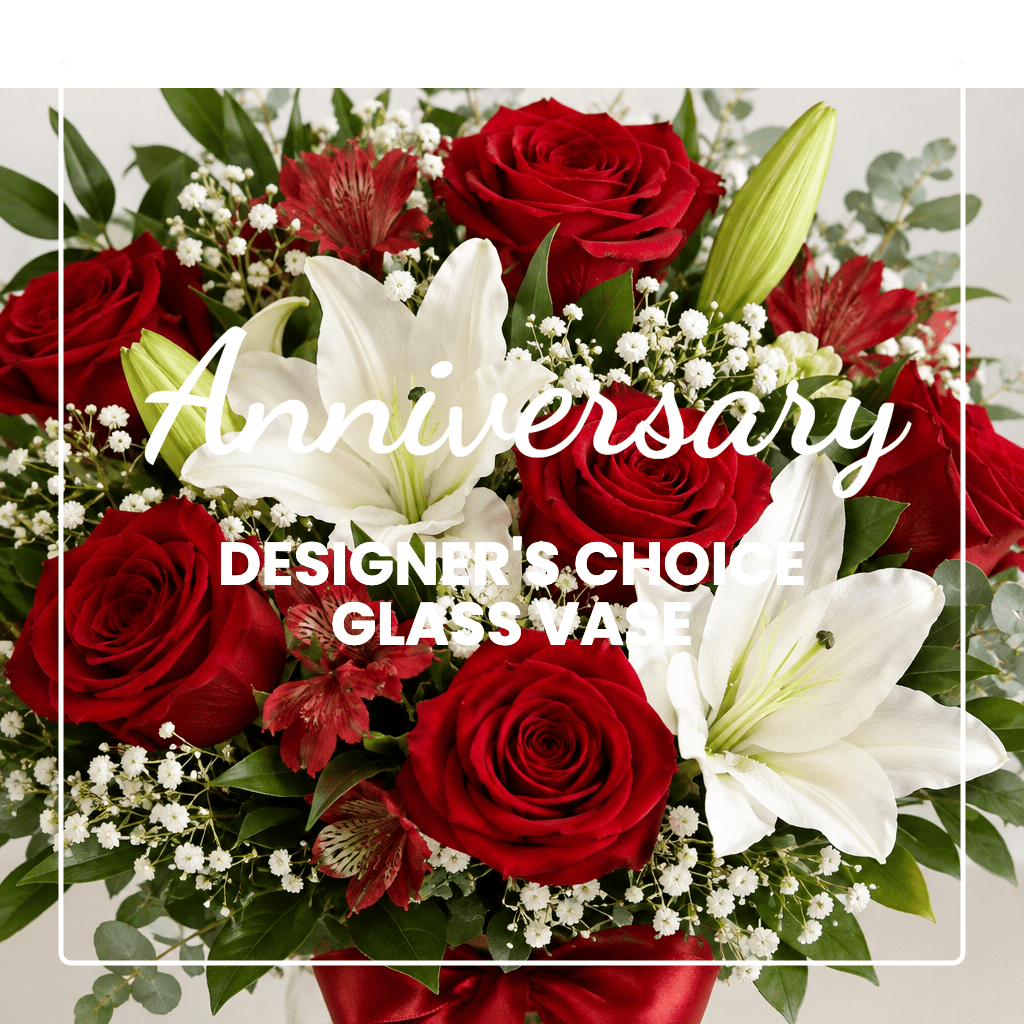 Red roses and white lilies in a glass vase with anniversary text overlay