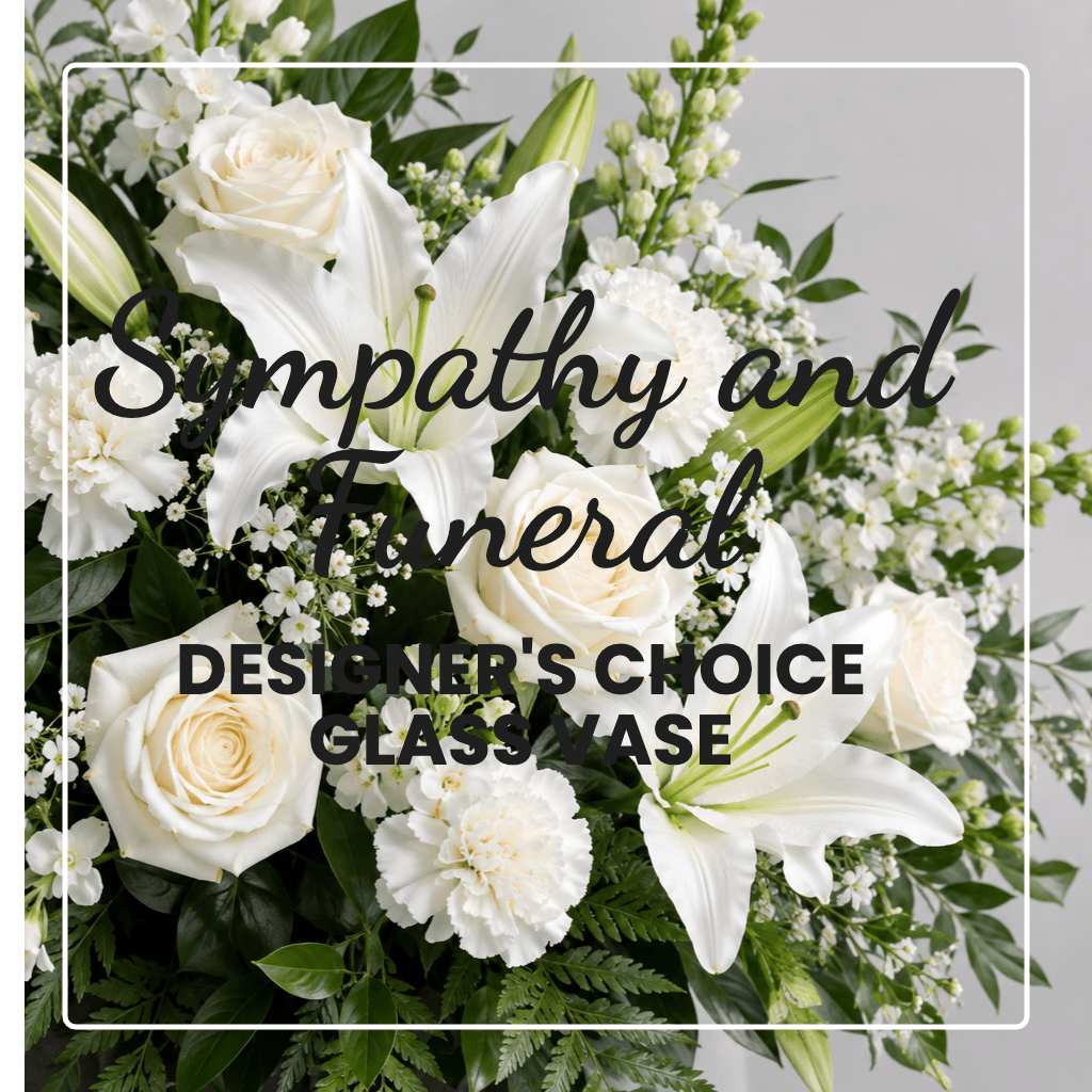 White roses and lilies in a glass vase with sympathy text overlay