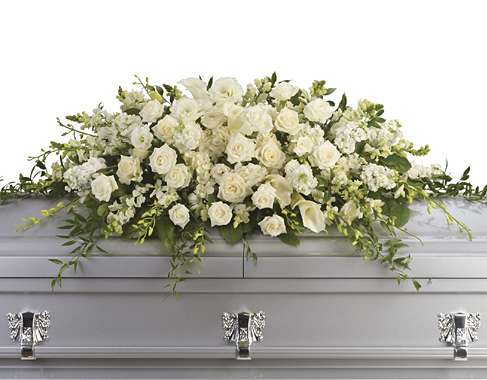 White floral casket spray with roses and calla lilies