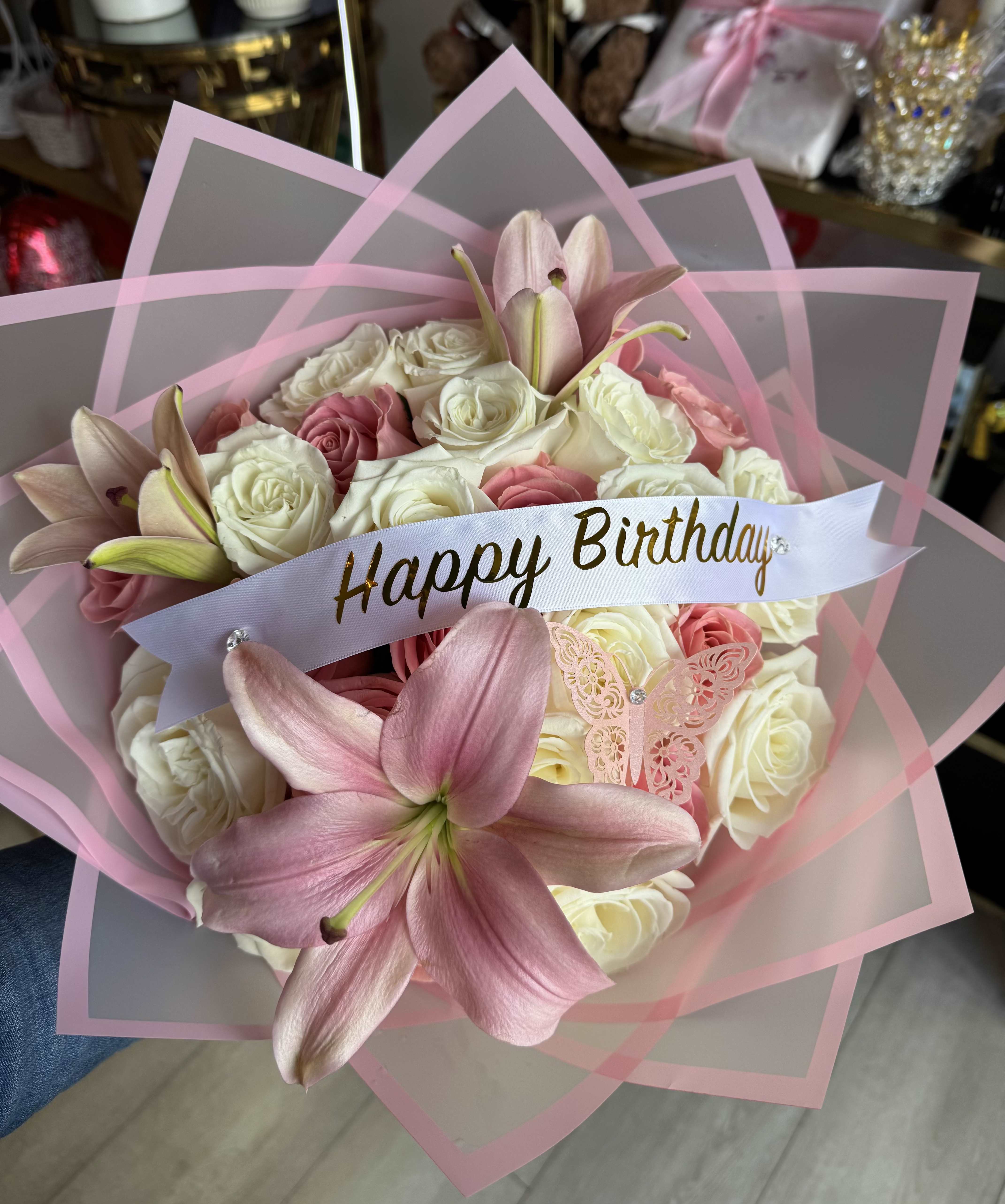 Blush Dream Bouquet  - A soft and elegant expression of love and celebration. Blush Dreams features a beautiful blend of premium white and pink roses, delicate pink lilies, and charming accents, all wrapped in luxurious pink layers for a stunning presentation. Perfect for birthdays or any special moment that deserves something extra beautiful.