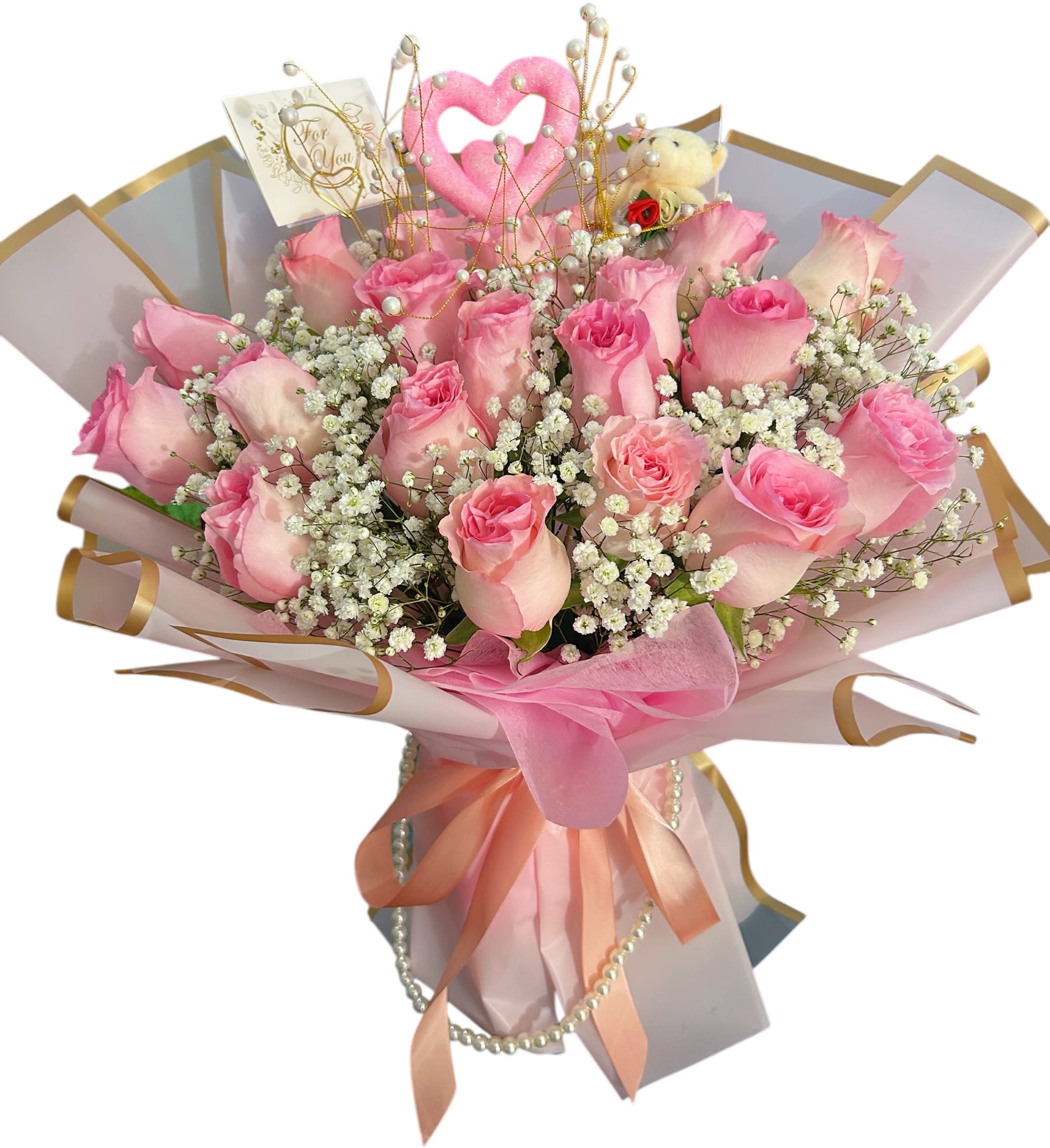 Bouquet of pink roses with baby's breath and a pink heart topper