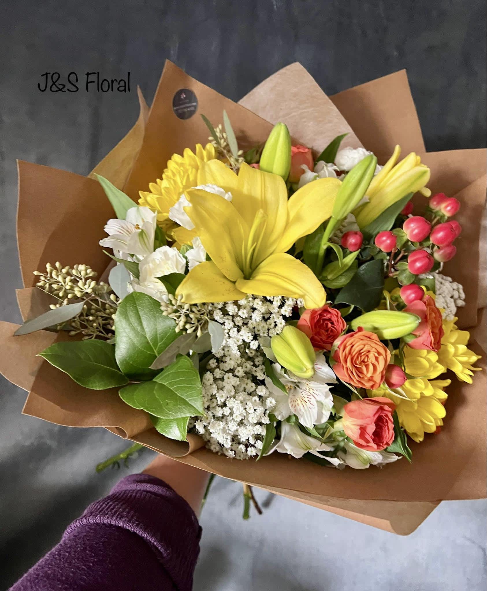 Luna Bouquet  - introducing Our New Design Luna hand tied bouquet, beautifully arranged with lilies, spray roses, berries, Alstroemeria, daisies, mini carnation fillers and greenery