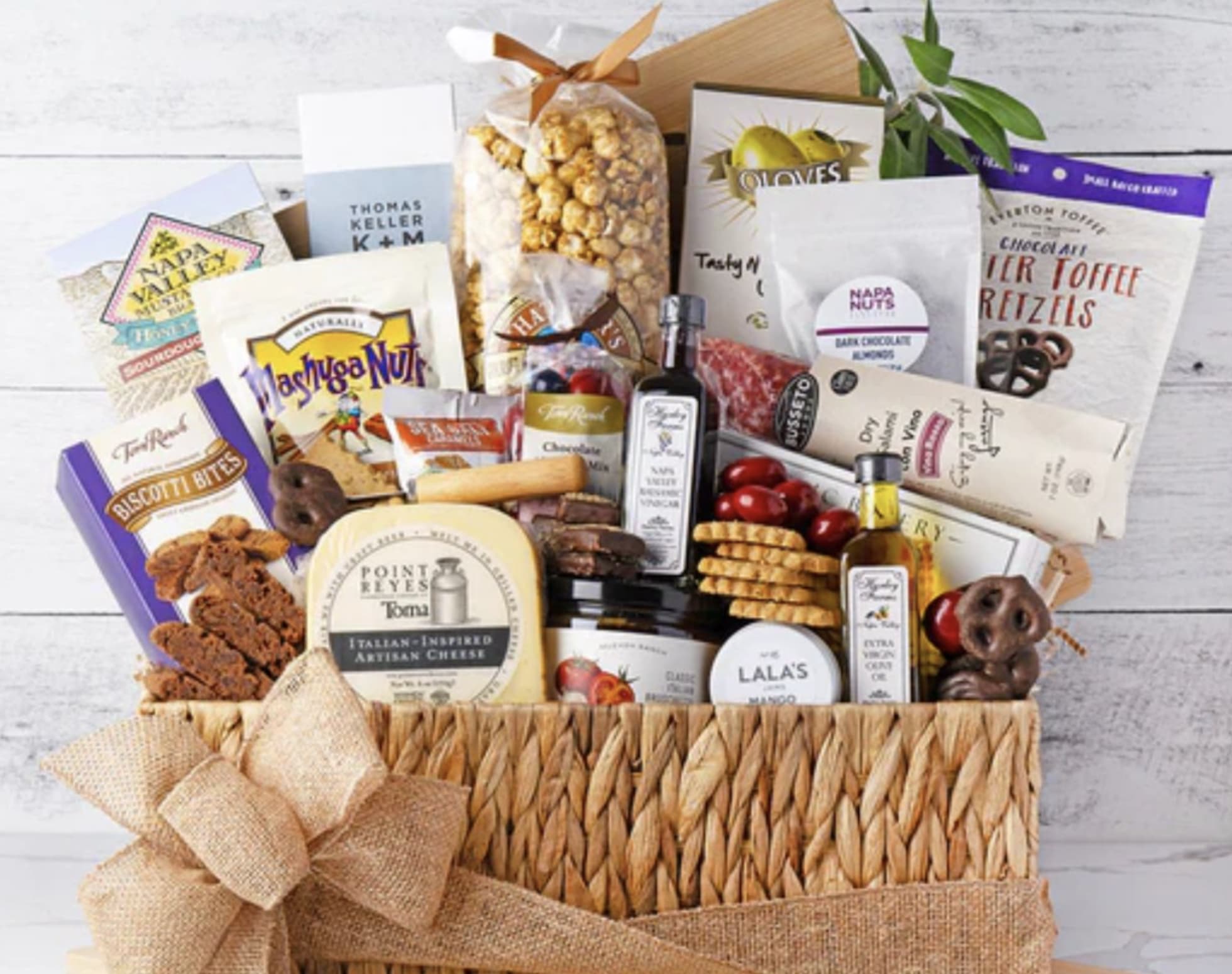 Gift basket filled with assorted gourmet snacks and packaged treats