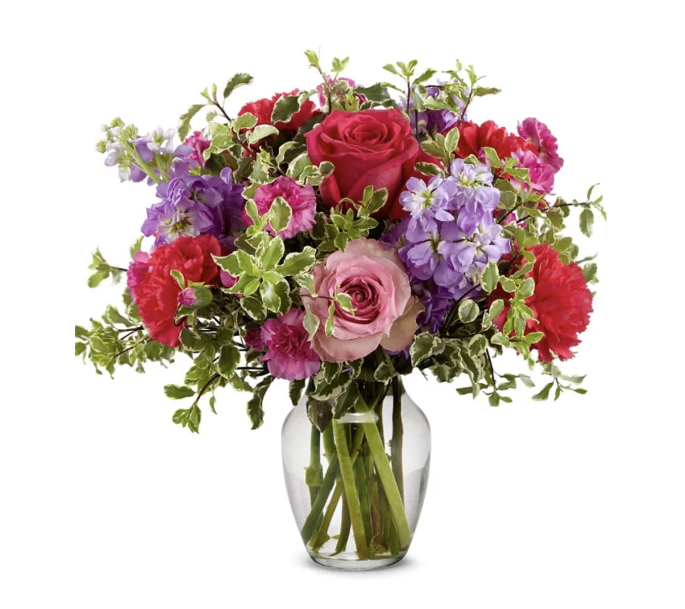 Mixed pink, purple, and red flowers in a clear glass vase