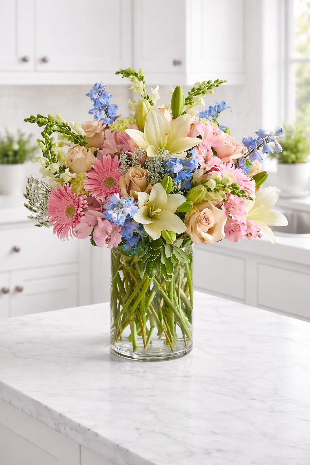 Mixed pastel bouquet in a clear glass vase