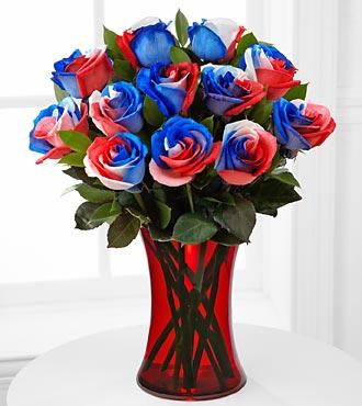 Bless the U.S.A. Fiesta Rose Bouquet - Picked fresh from the farm, the Bless the U.S.A. Fiesta Rose Bouquet is bursting with patriotic pride and extreme color to capture and hold their attention with its unique style and charm. Each rose is special treated to exhibit the red-white-blue color palate that represents Old Glory herself.  Your choice of red, blue or clear vase.   Because we order these straight from the farm in South America, we need at least 4 business days advance notice to get these.  So please order a week in advance.