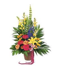 Tropical flower arrangement in a basket with bright mixed blooms