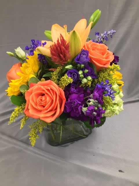Crisp and Colorful - A Mixture of beautiful fall blooms arranged in a cube. A perfect gift for any occasion.   *Pictured at Deluxe Pricing*
