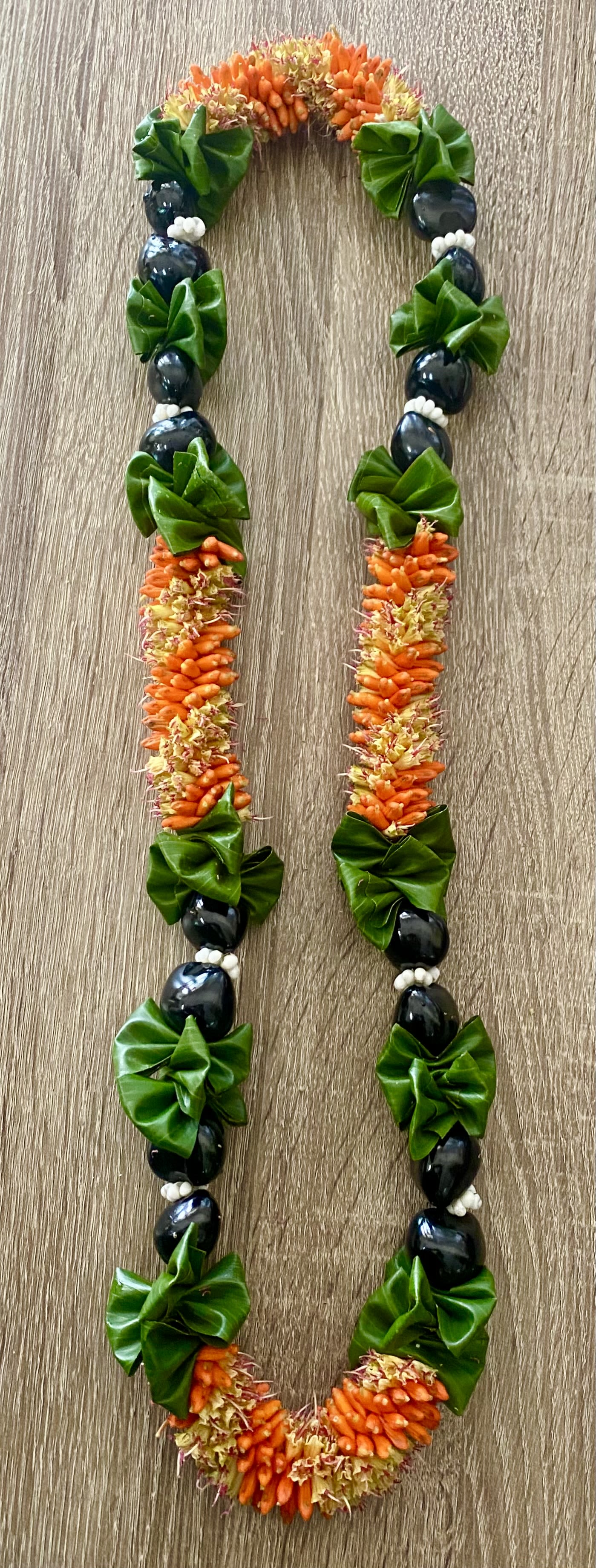 CIGAR FLOWER/ KUKUI NUT/TI LEAF LEI - CIGAR FLOWER/ KUKUI NUT/TI LEAF LEI *NOTE 40.00 MINIMUM FOR DELIVERY