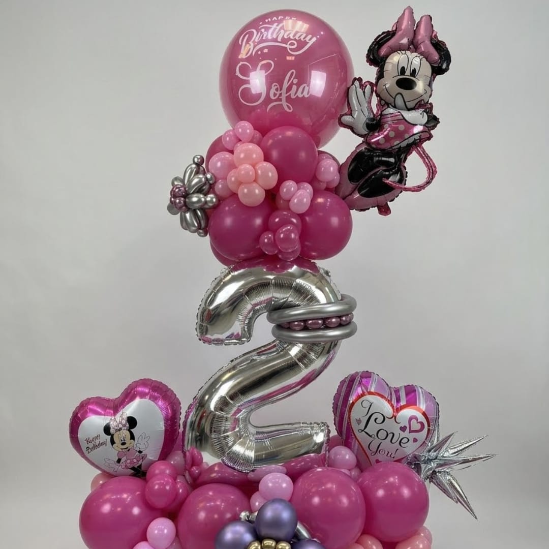 Pink birthday balloon arrangement with Minnie Mouse balloons and a large silver number 2.