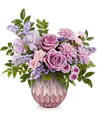 Lavender and pink bouquet in a textured pink vase
