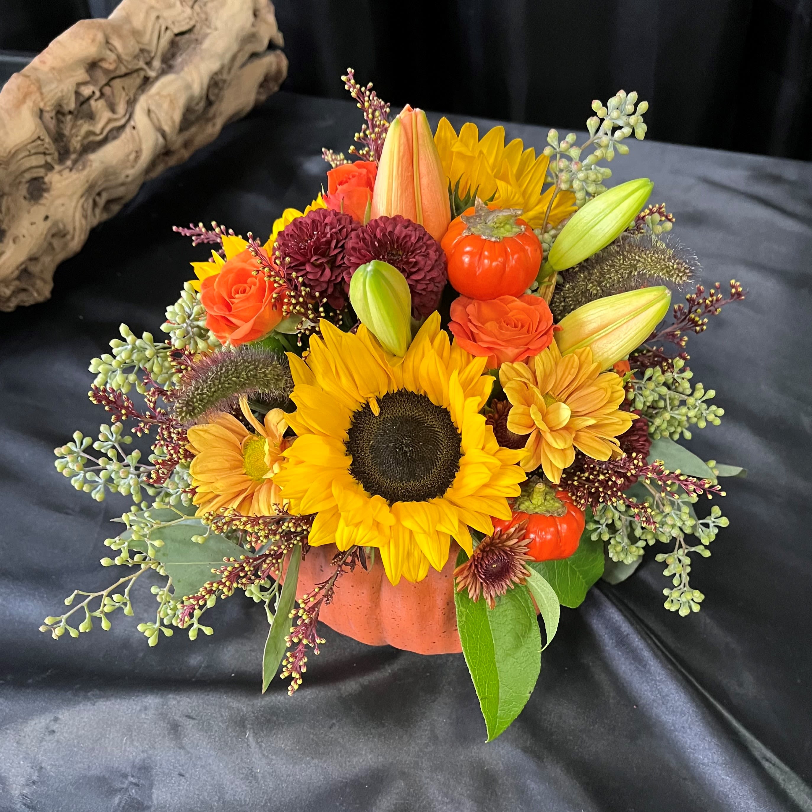 Pumpkin Patch - Perfect for a small centerpiece. A beautiful fall flowers in an orange ceramic pumpkin. 