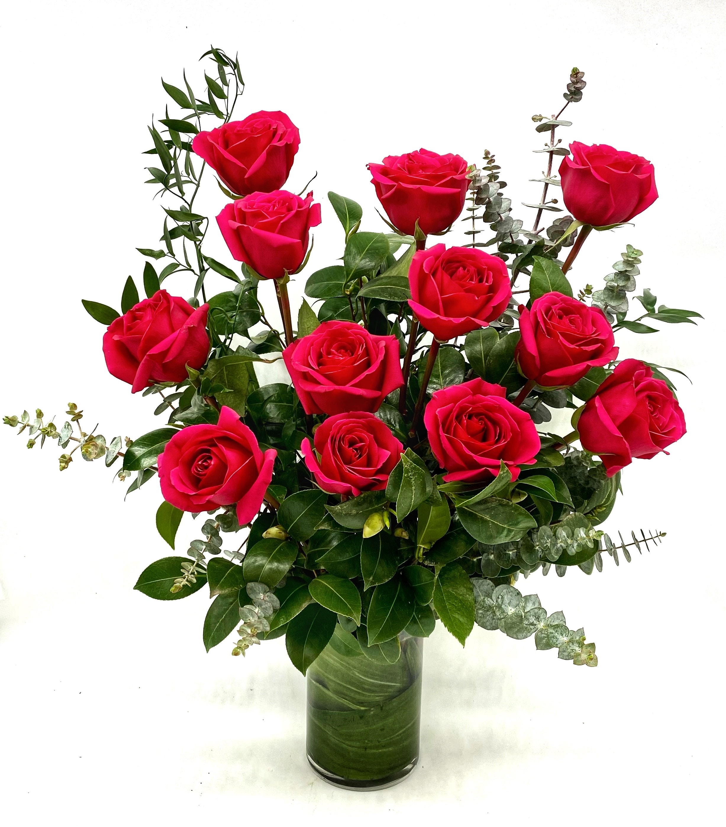 Classic Hot Pink Rose - Our take on a classic arrangement of beautiful premium hot pink roses. Our roses are of the best quality in the industry and hand picked each week for the freshest blooms available. Choose between 1 dozen or 2 dozen roses arranged with seasonal greenery. A timeless gift of love or thoughtfulness. 